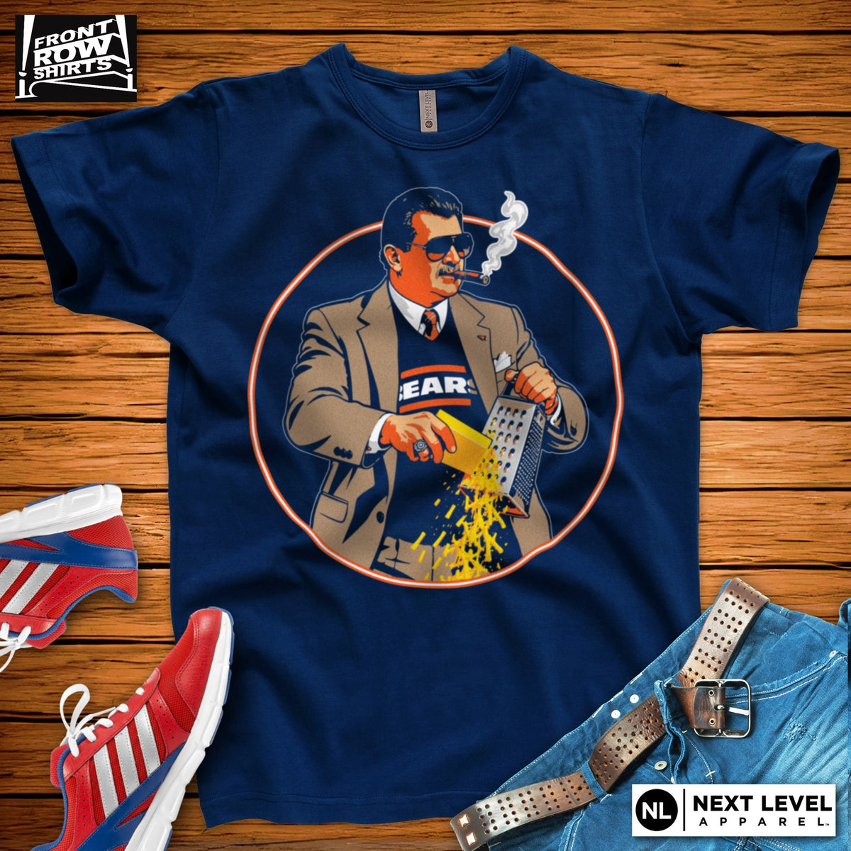Navy T-shirt with Mike Ditka wearing sunglasses and a Bears sweater, smoking a cigar and grating cheese inside an orange circle.